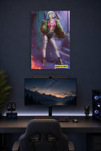 Harley Quinn from Birds of Prey in a gaming desk setup above a monitor.