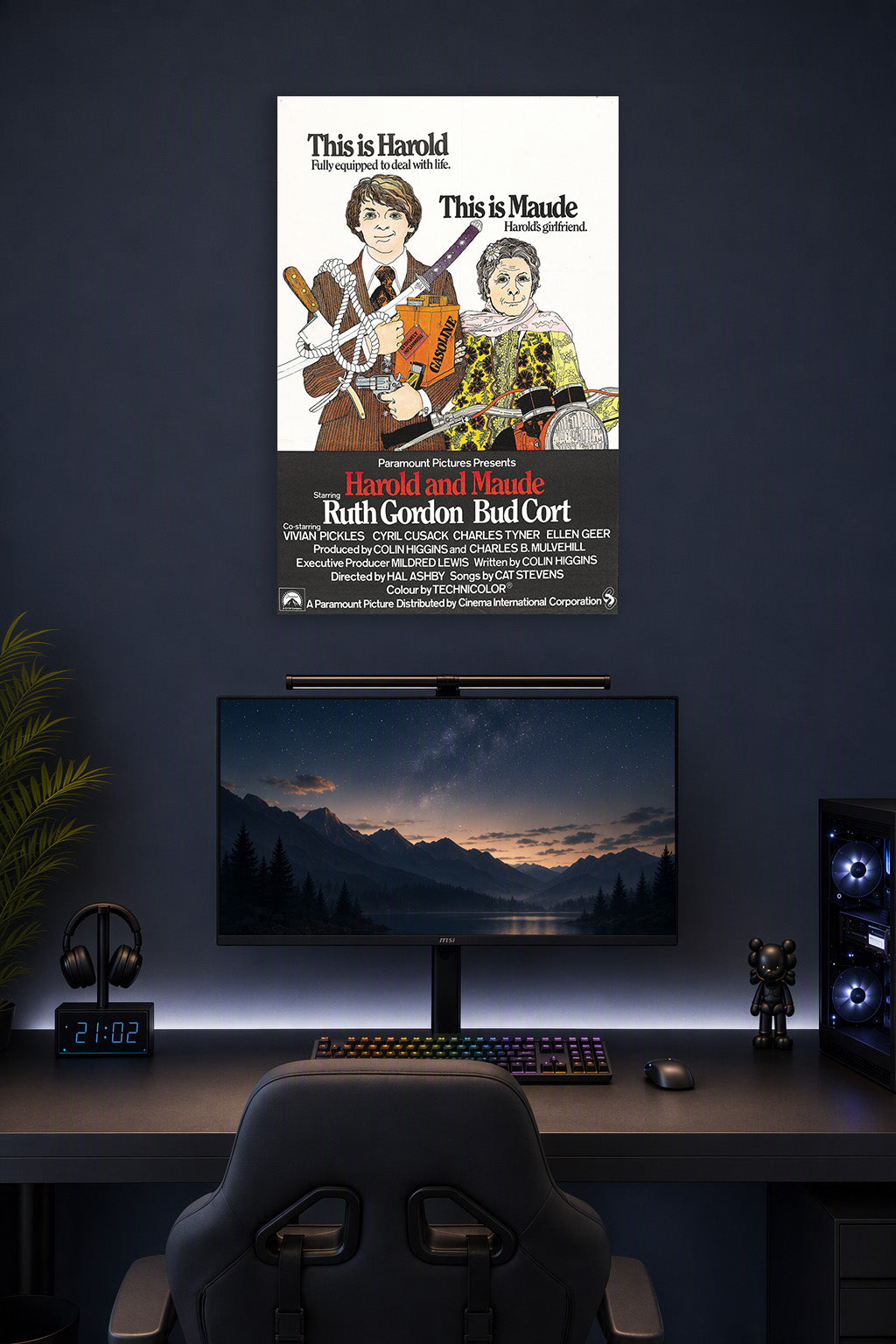 Harold and Maude Movie Poster in a gaming desk setup above a monitor.