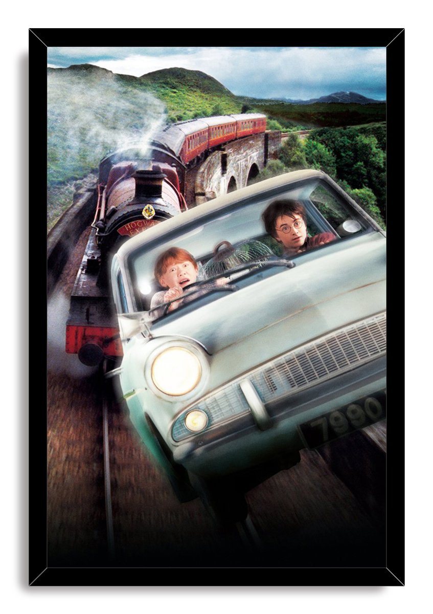 Harry Potter framed wall art print of the flying car pursued by the Hogwarts Express, with misty mountains and a black frame.