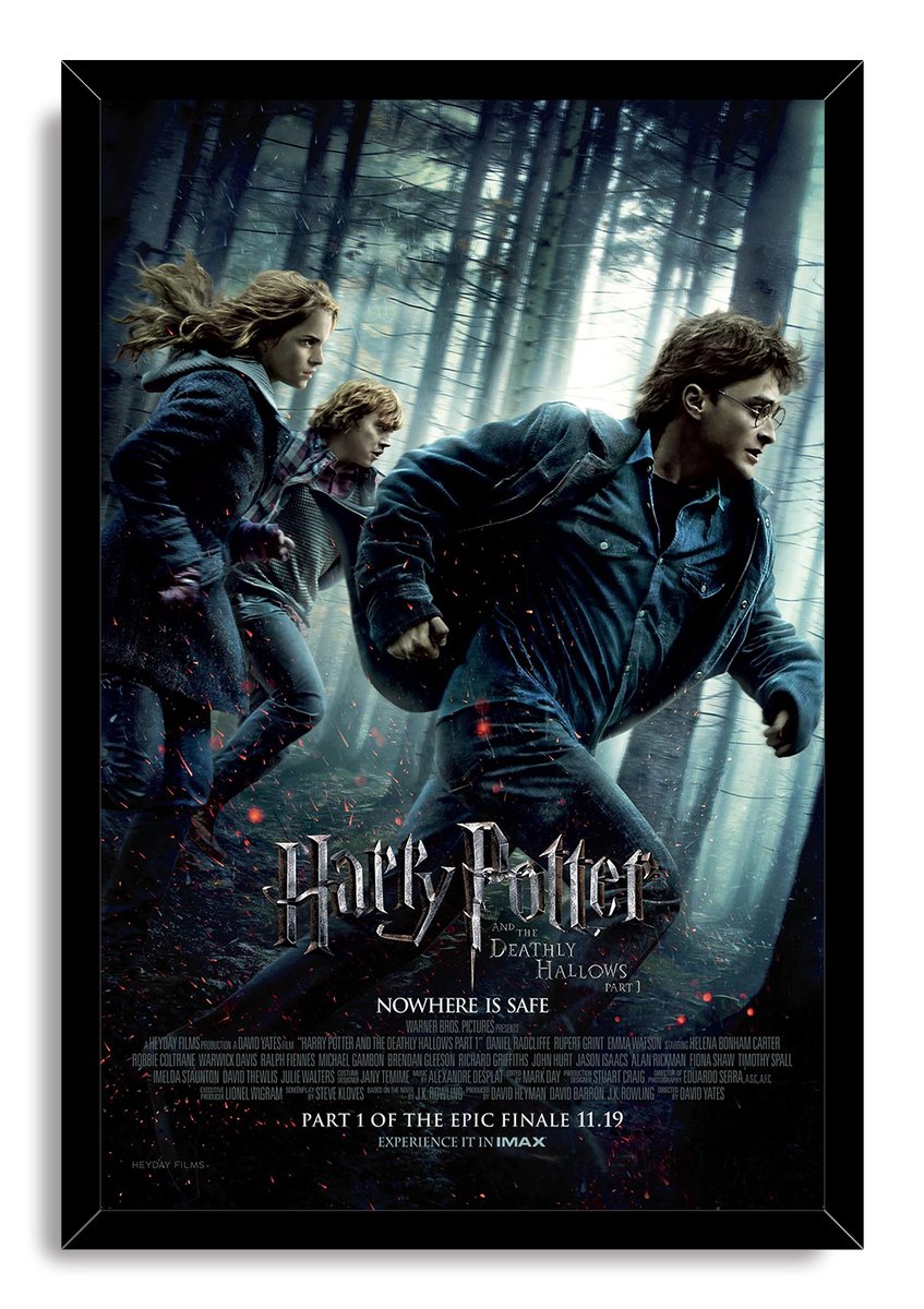 Harry Potter and the Deathly Hallows Part 1 framed wall art print shows Harry, Hermione, and Ron sprinting through a dark forest.
