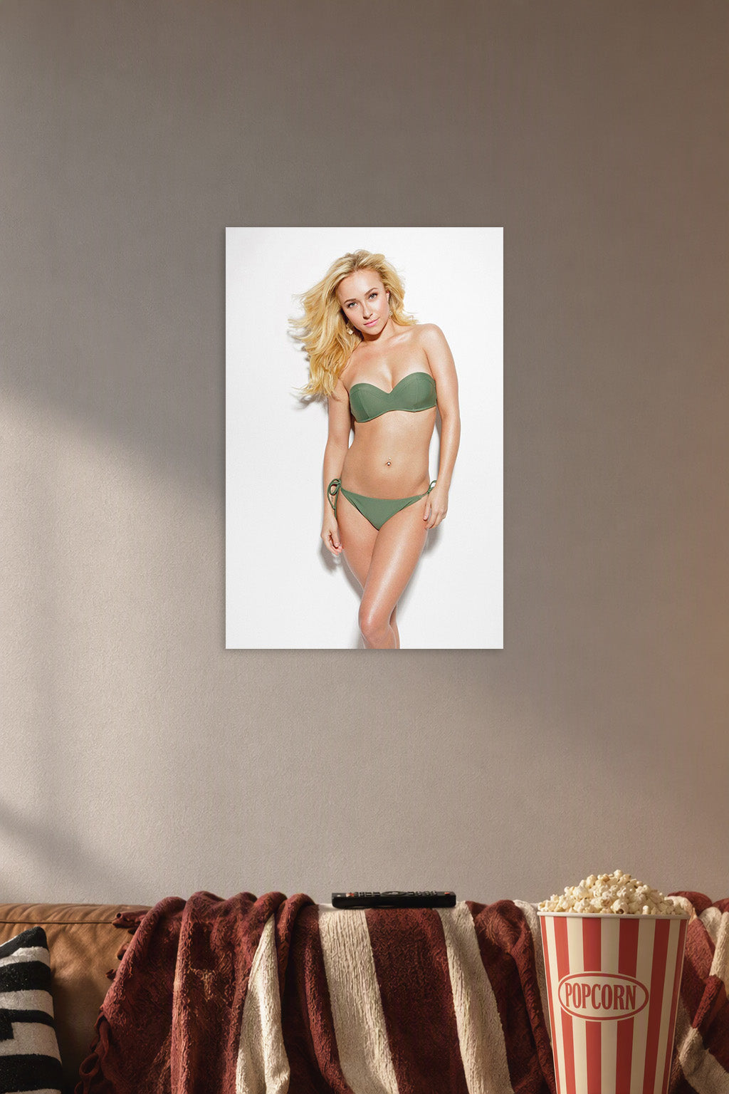 Hayden Panettiere in a cozy movie room above a brown sofa with popcorn.