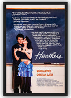 Heathers framed wall art print shows Winona Ryder kissing Christian Slater, with chalkboard reviews and orange cast names.