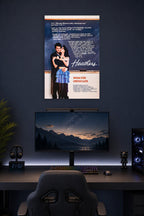 Heathers Movie in a gaming desk setup above a monitor.