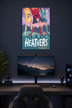 Heathers The Musical in a gaming desk setup above a monitor.