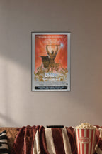 Heavy Metal Movie Poster in a cozy movie room above a brown sofa with popcorn.