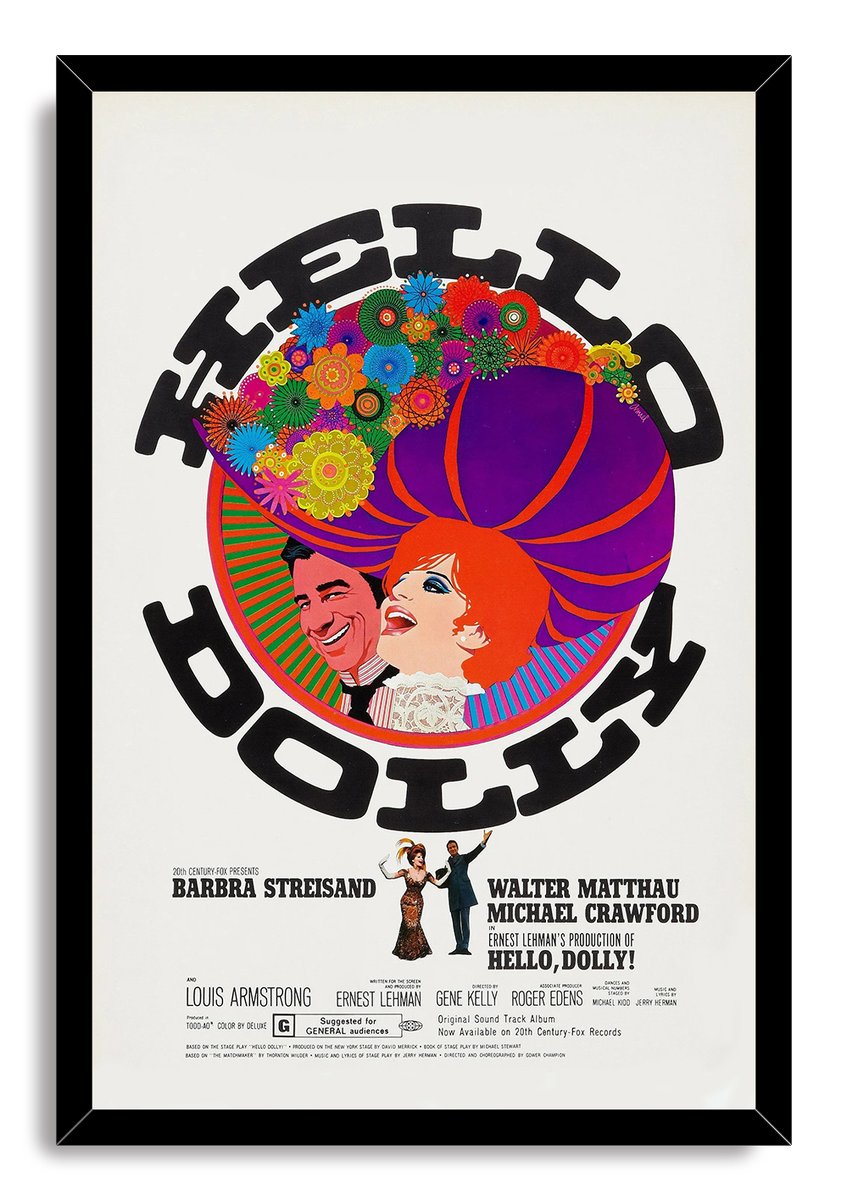 Hello, Dolly! framed wall art print with black border, vivid floral headdress, purple hat, illustrated stars, and title typography.
