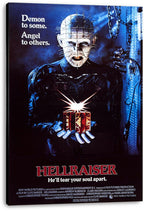 Hellraiser canvas wall art print featuring Pinhead holding a glowing red puzzle box beneath hanging chains.