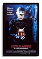 Hellraiser framed wall art print featuring Pinhead with facial pins, a glowing puzzle box, and blue industrial chains.