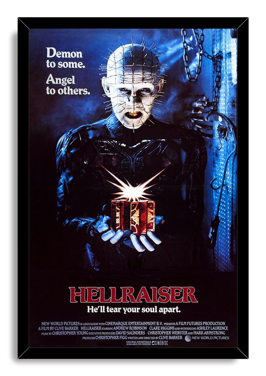 Hellraiser framed wall art print featuring Pinhead with facial pins, a glowing puzzle box, and blue industrial chains.
