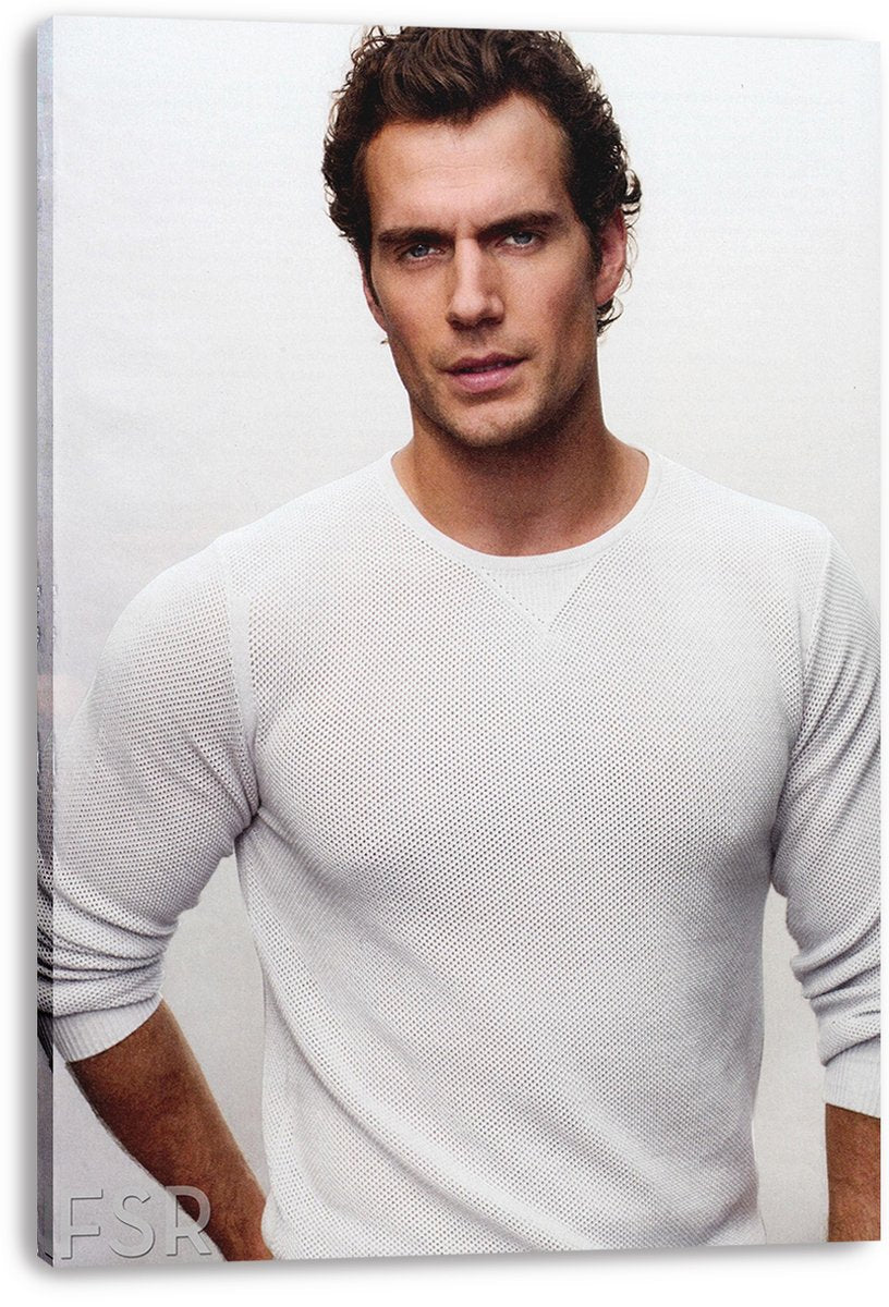 Henry Cavill canvas wall art print presents a close portrait of the actor wearing a white textured shirt on a light neutral backdrop.