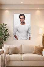 Henry Cavill in a bright living room above a beige sofa.