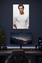 Henry Cavill in a gaming desk setup above a monitor.