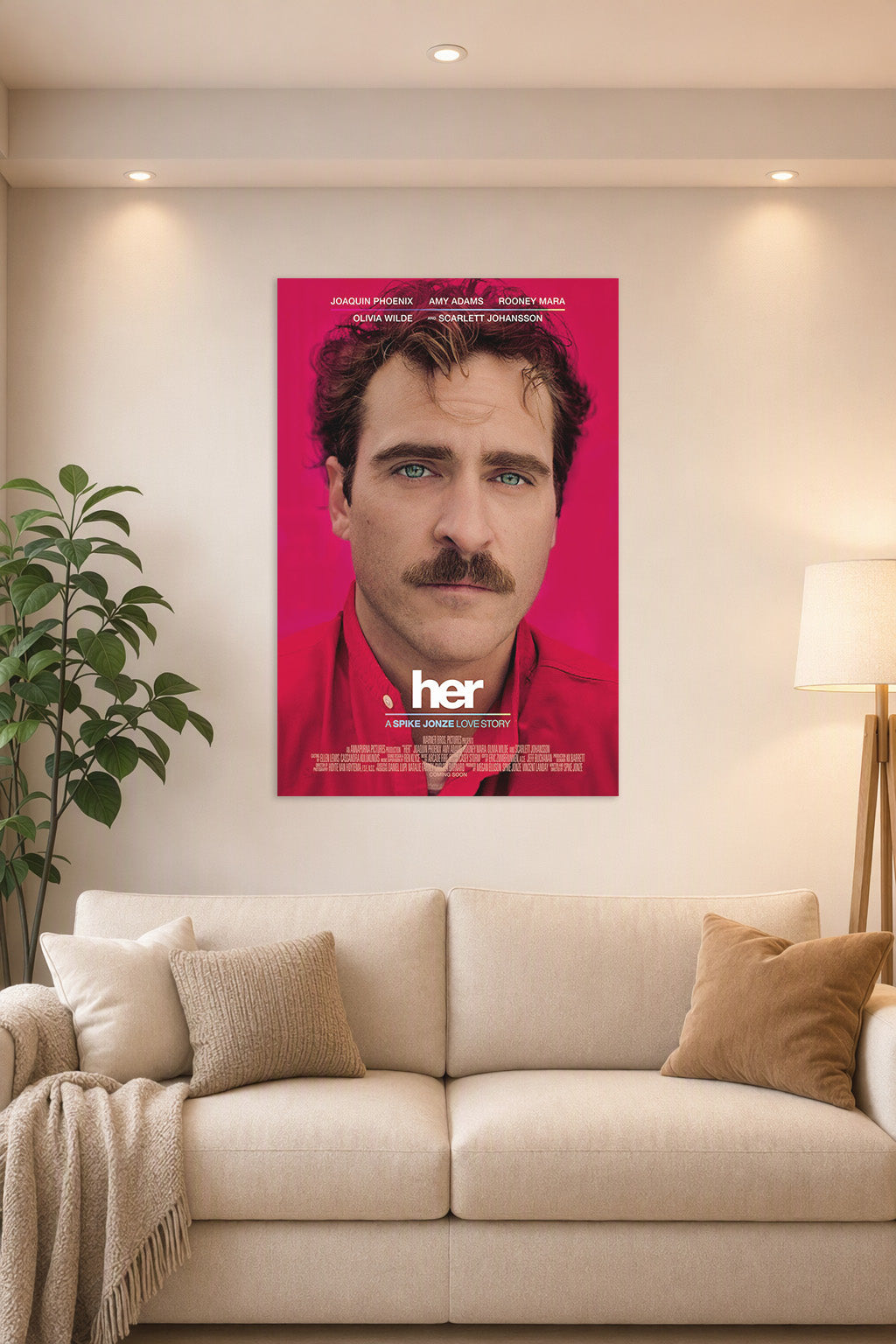 Her Movie Joaquin Phoenix in a bright living room above a beige sofa.