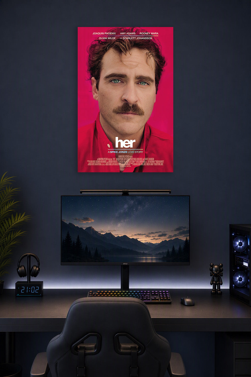 Her Movie Joaquin Phoenix in a gaming desk setup above a monitor.
