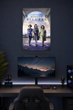 Hidden Figures Movie Poster in a gaming desk setup above a monitor.
