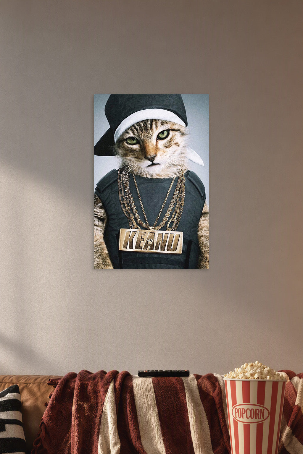 Hip-Hop Cat Keanu in a cozy movie room above a brown sofa with popcorn.