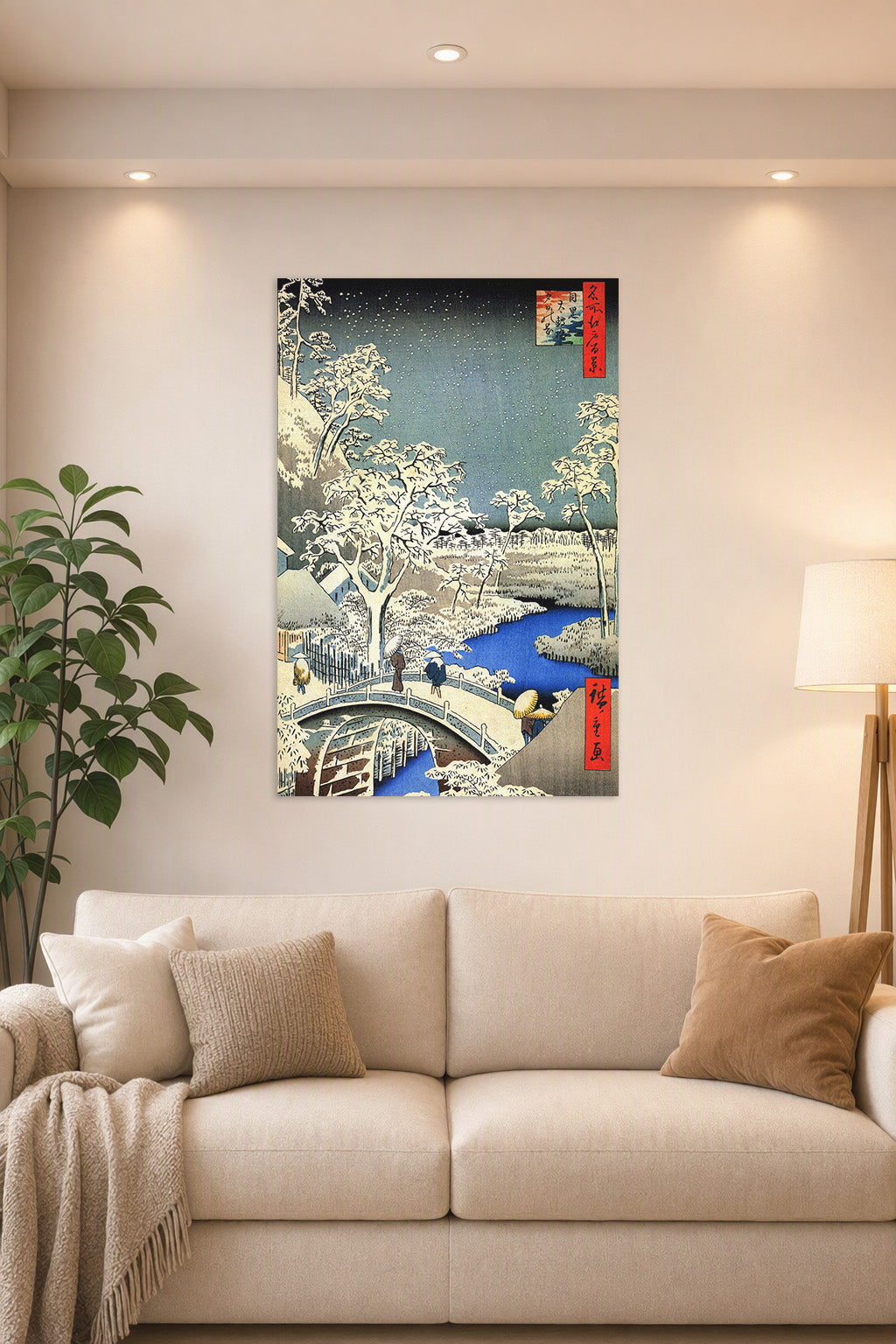 Hiroshige Style Winter Village Snowy Landscape in a bright living room above a beige sofa.