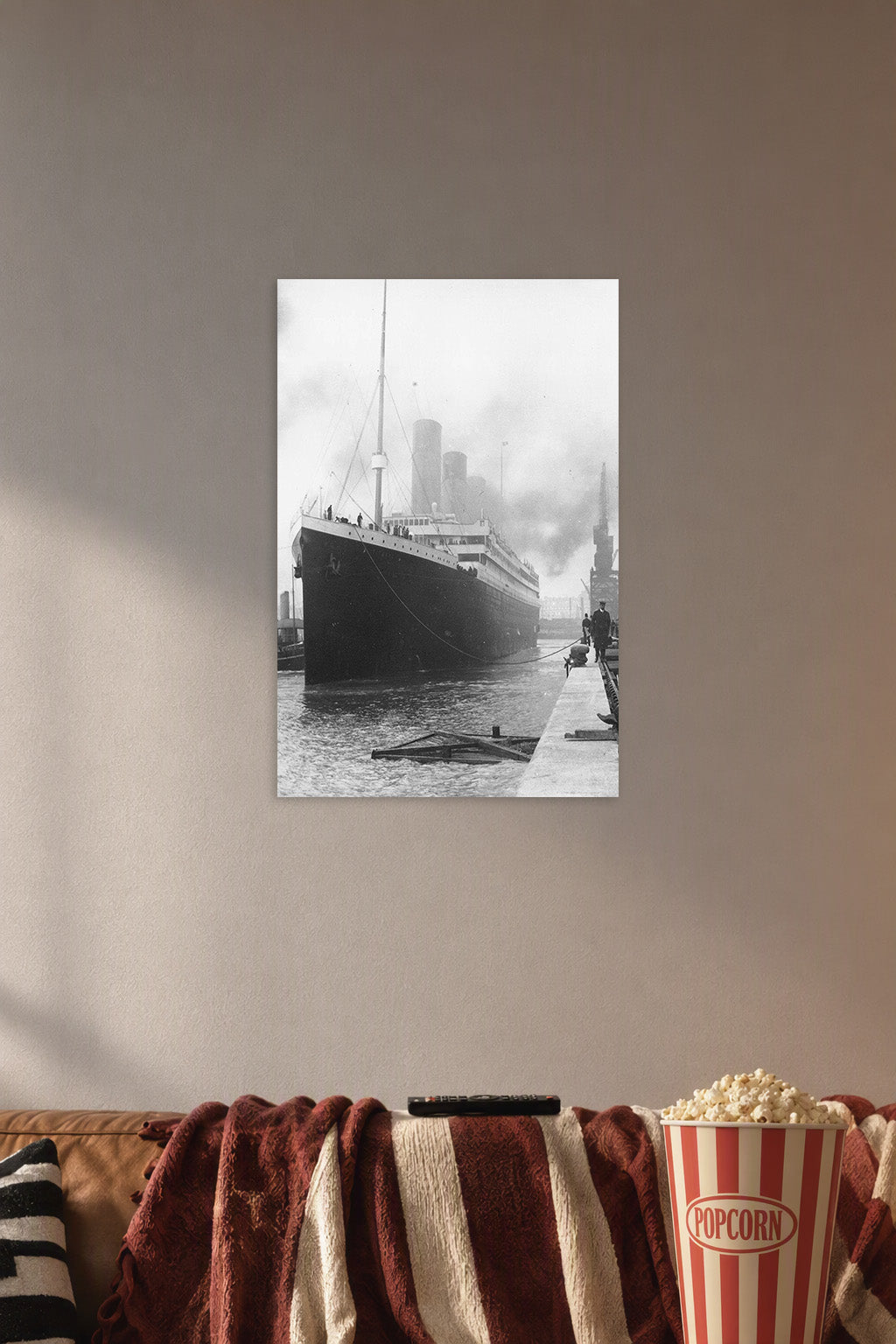 Historic Titanic Ship in a cozy movie room above a brown sofa with popcorn.