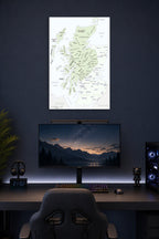 Historical Scottish Clans Map in a gaming desk setup above a monitor.