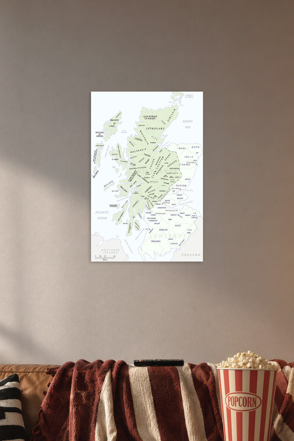 Historical Scottish Clans Map in a cozy movie room above a brown sofa with popcorn.