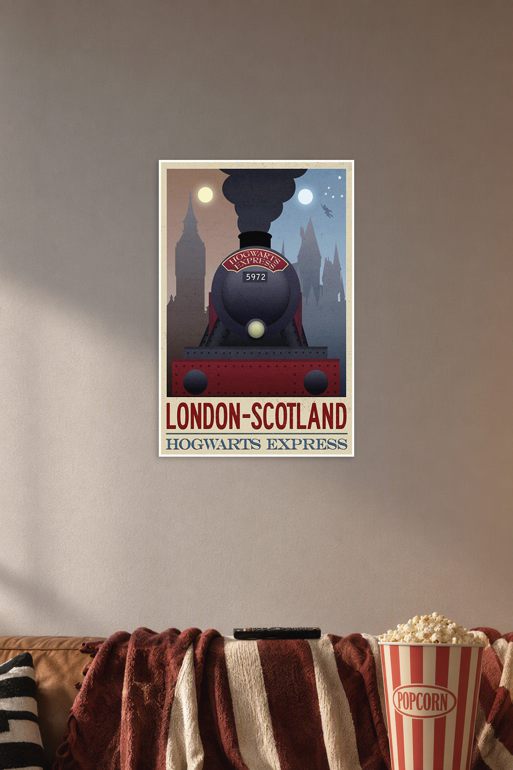Hogwarts Express London Scotland Travel in a cozy movie room above a brown sofa with popcorn.