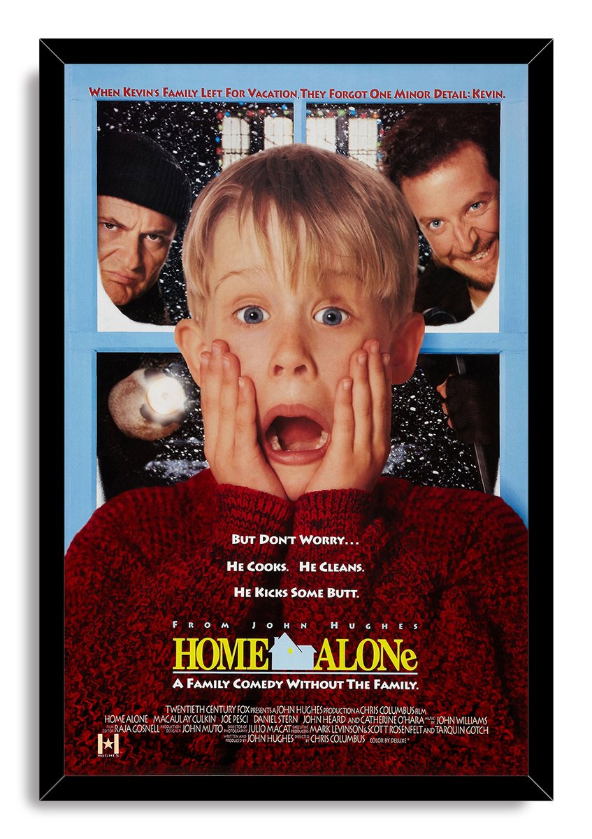 Framed Home Alone wall art print of Kevin clutching his cheeks in alarm before a snowy blue window with two men behind him.