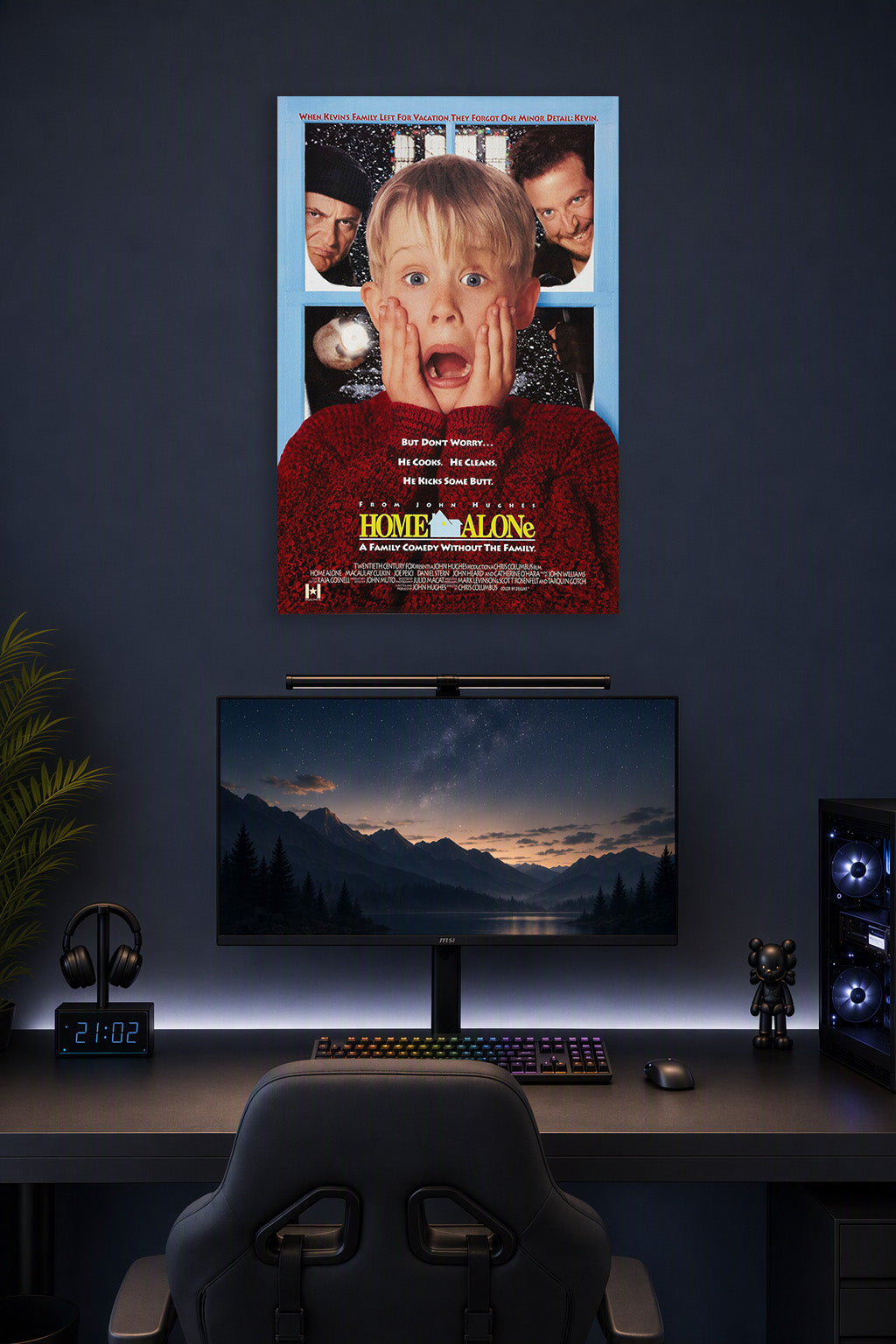 Home Alone Kevin McCallister in a gaming desk setup above a monitor.