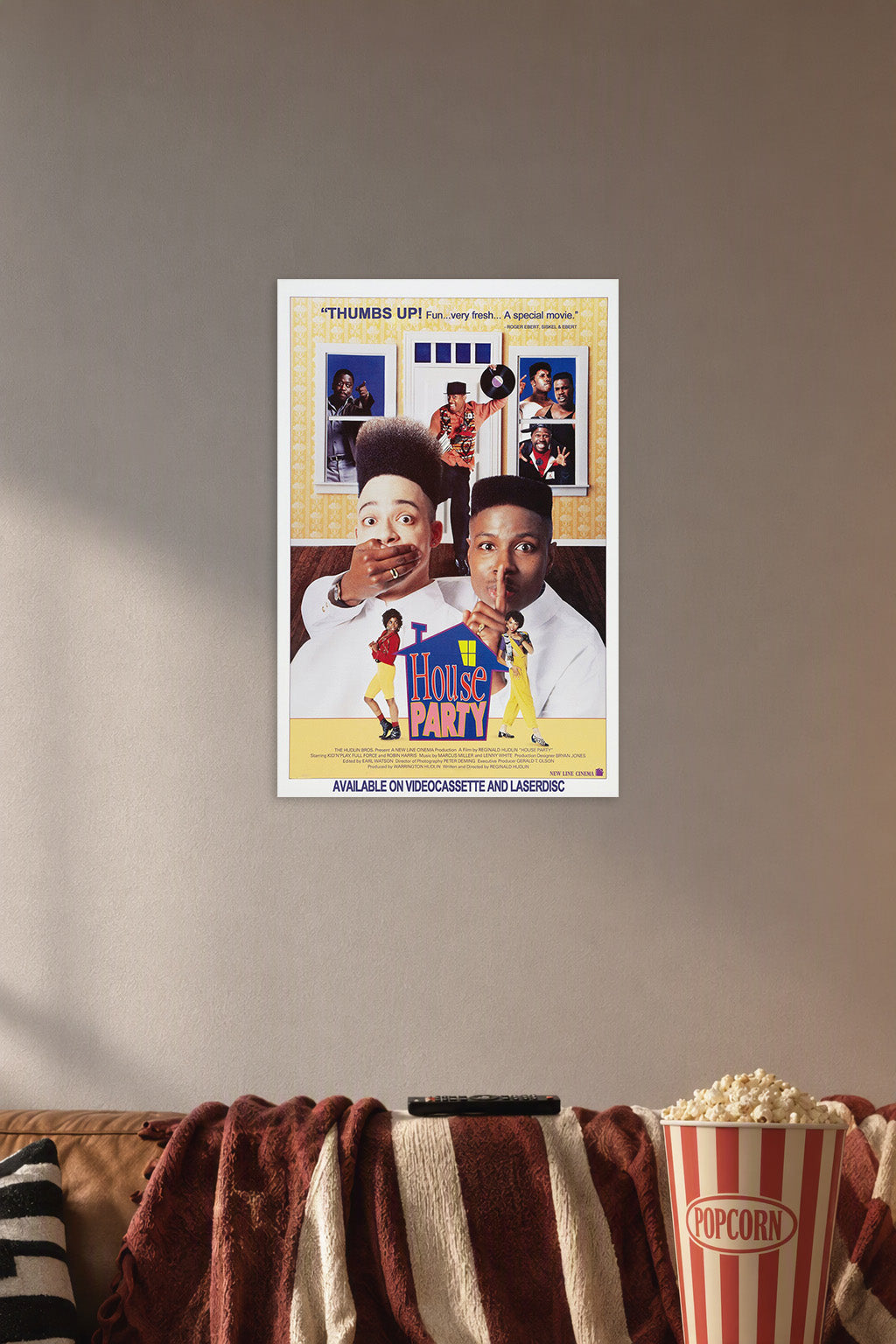 House Party Movie Poster in a cozy movie room above a brown sofa with popcorn.