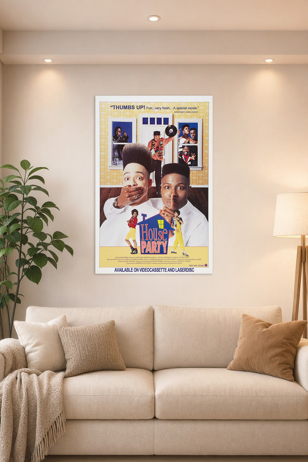 House Party Movie Poster in a bright living room above a beige sofa.