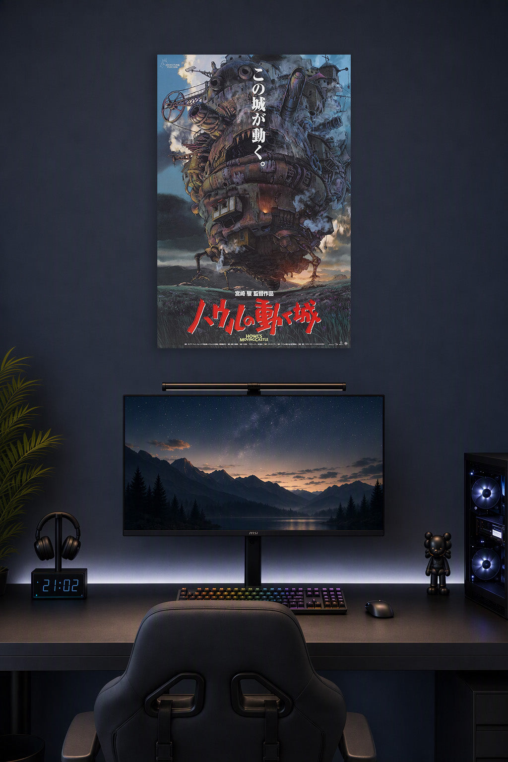 Howl's Moving Castle in a gaming desk setup above a monitor.