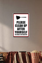 Humorous Cleaning Reminder Sign in a cozy movie room above a brown sofa with popcorn.