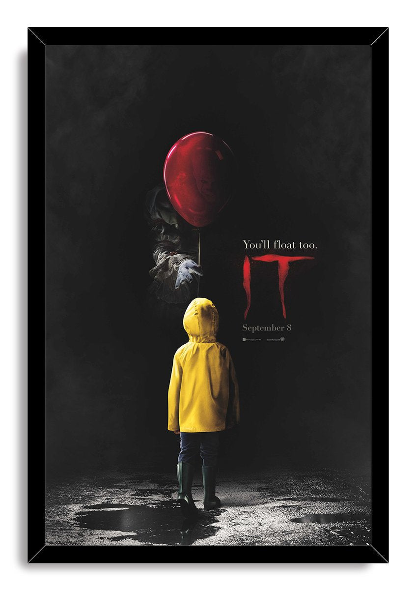 Framed IT poster wall art print featuring a child in a yellow raincoat beneath a red balloon, with Pennywise emerging from darkness.