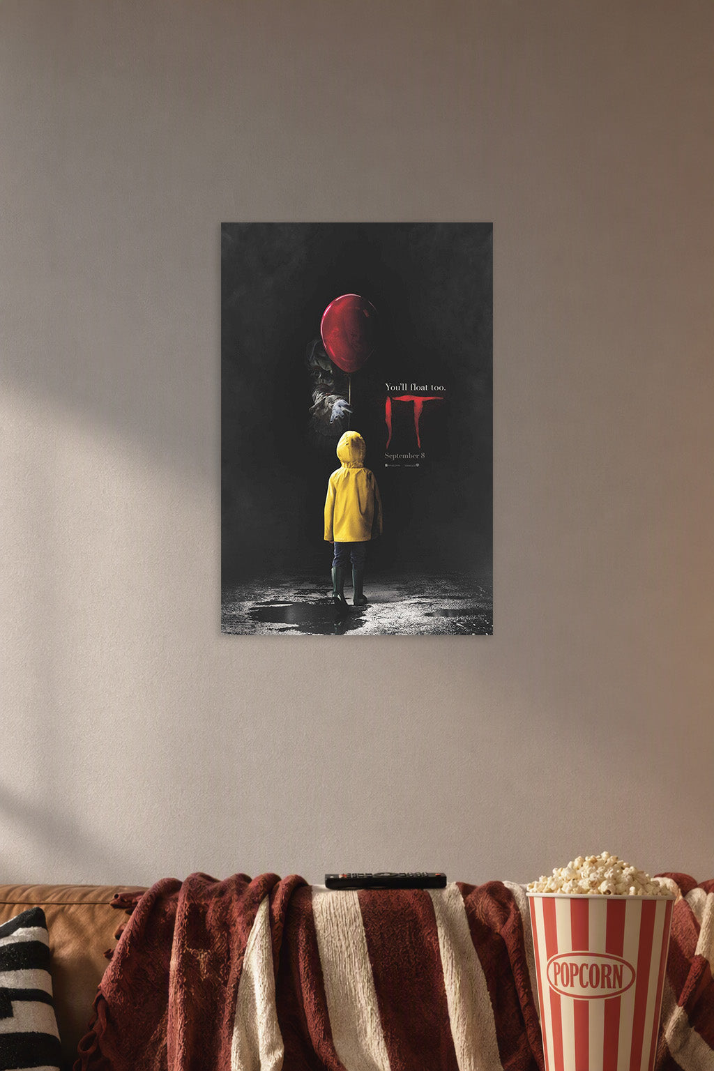IT Movie Pennywise Red Balloon in a cozy movie room above a brown sofa with popcorn.