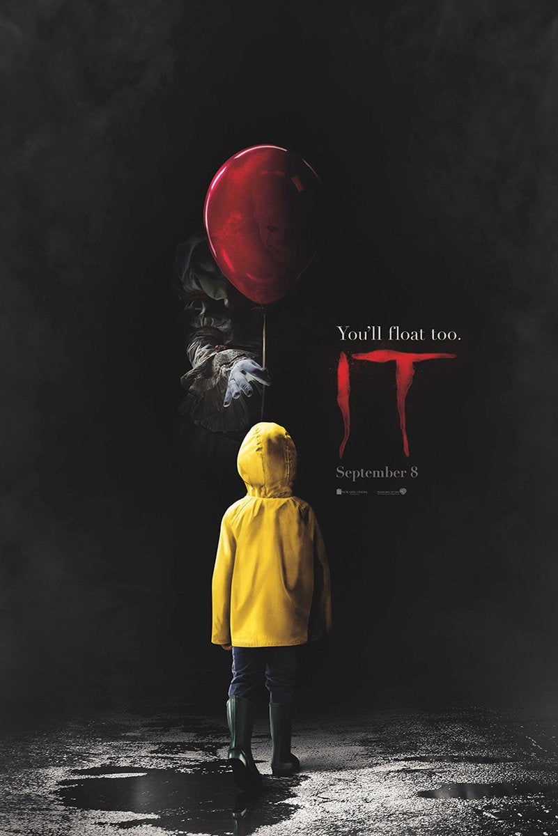 IT movie poster wall art print with a child in a yellow raincoat facing a red balloon and shadowy Pennywise on wet pavement.