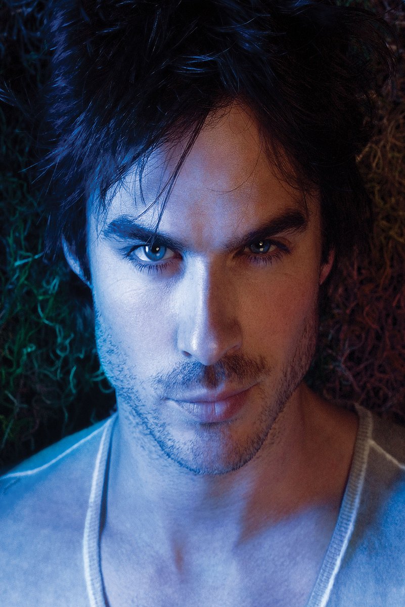 Ian Somerhalder wall art print features a close-up portrait with tousled dark hair, blue eyes, and split blue and warm lighting.