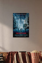 Inception Movie Poster in a cozy movie room above a brown sofa with popcorn.