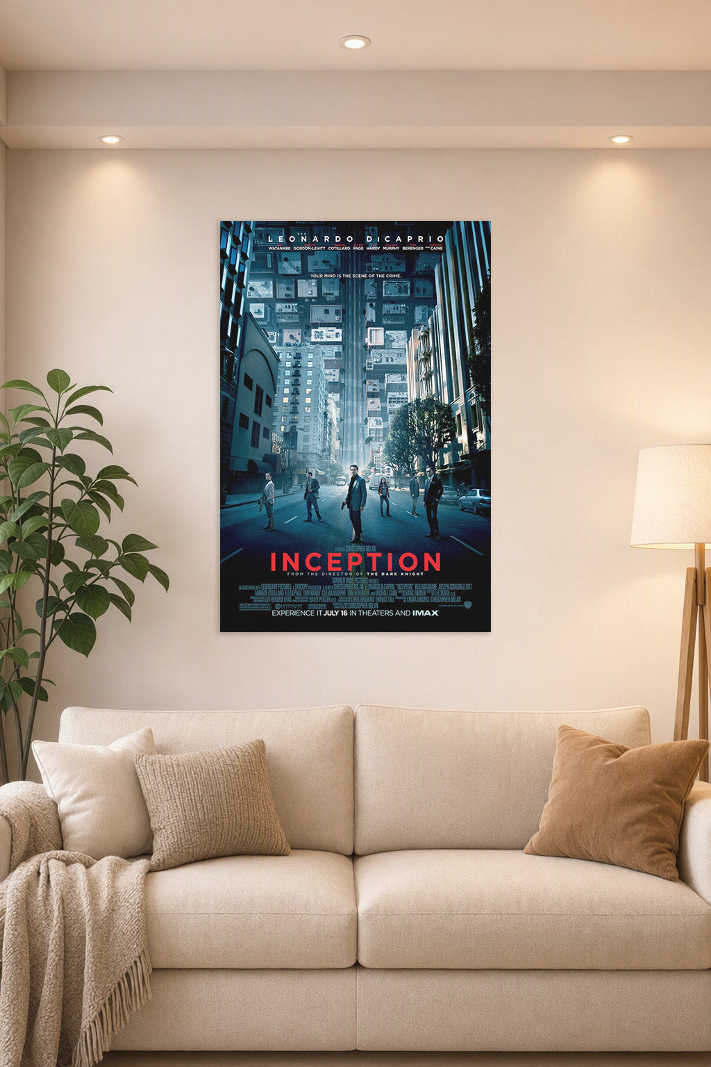 Inception Movie Poster in a bright living room above a beige sofa.