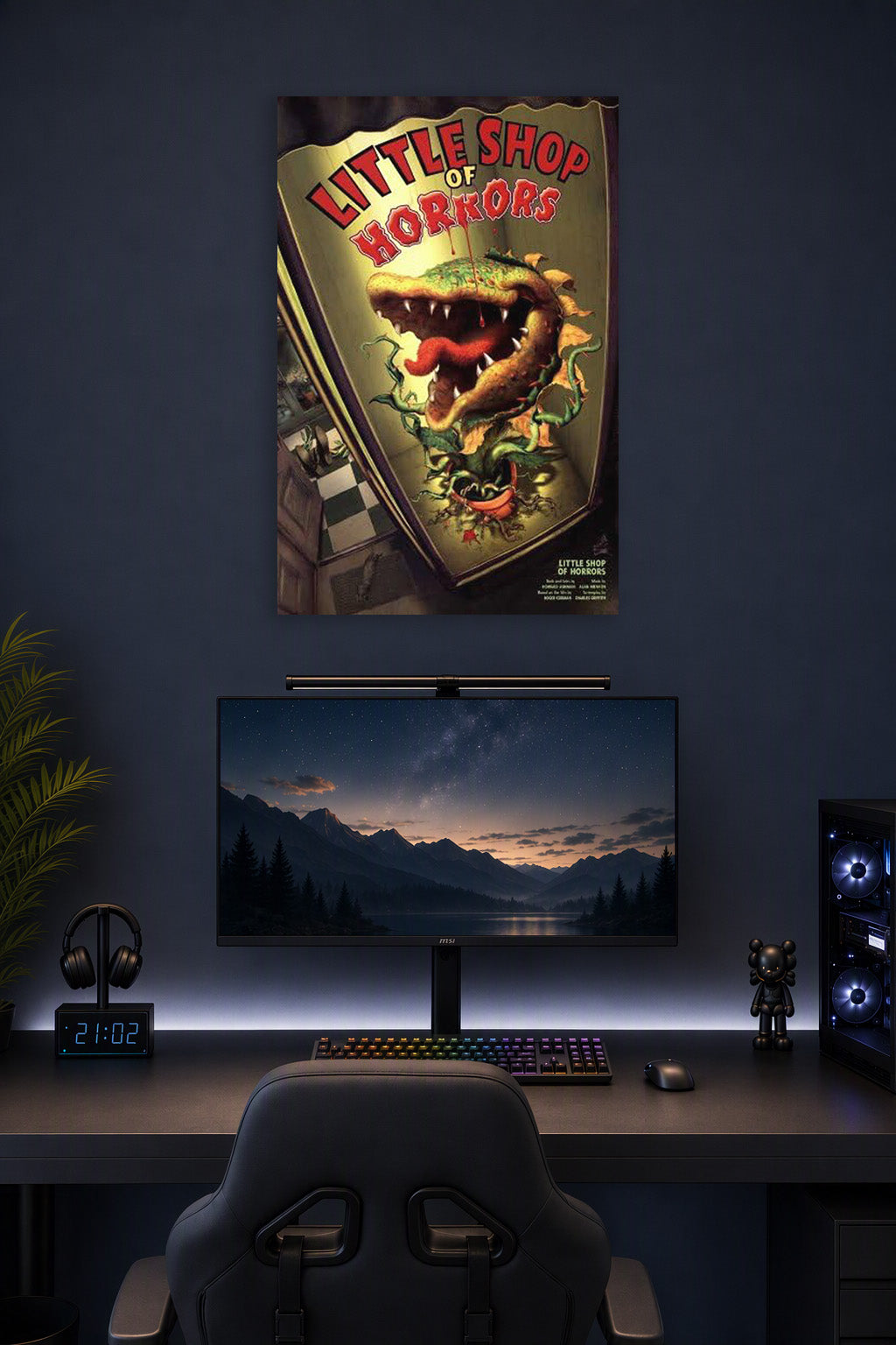 Incline Wholesale Movie Posters Little Shop of Horrors Broadway in a gaming desk setup above a monitor.
