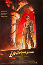 Indiana Jones Temple of Doom poster features the fedora-wearing adventurer with a whip and machete before a fiery temple.