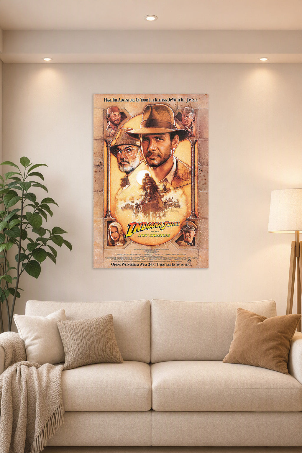 Indiana Jones and the Last Crusade Movie Poster in a bright living room above a beige sofa.