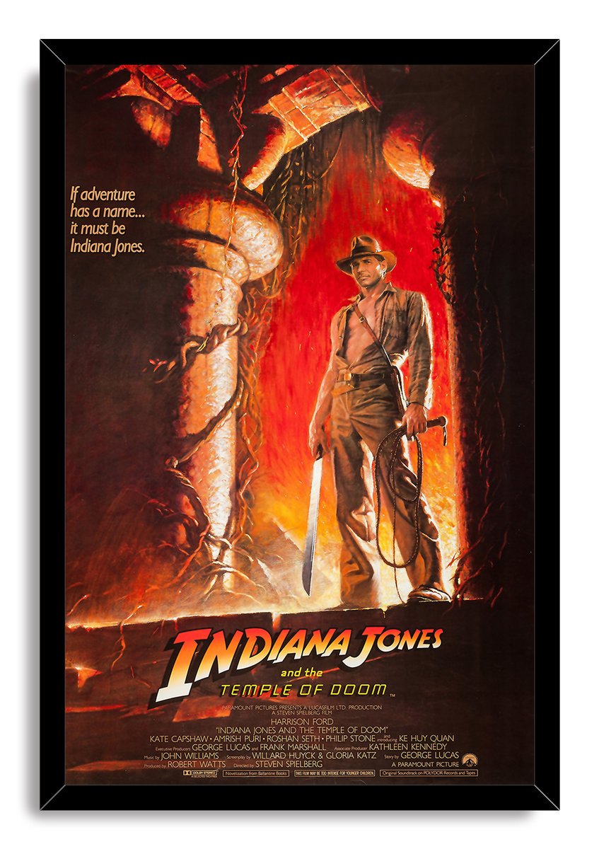 Indiana Jones and the Temple of Doom framed wall art print presents the hero with a coiled whip against a blazing ancient temple scene.