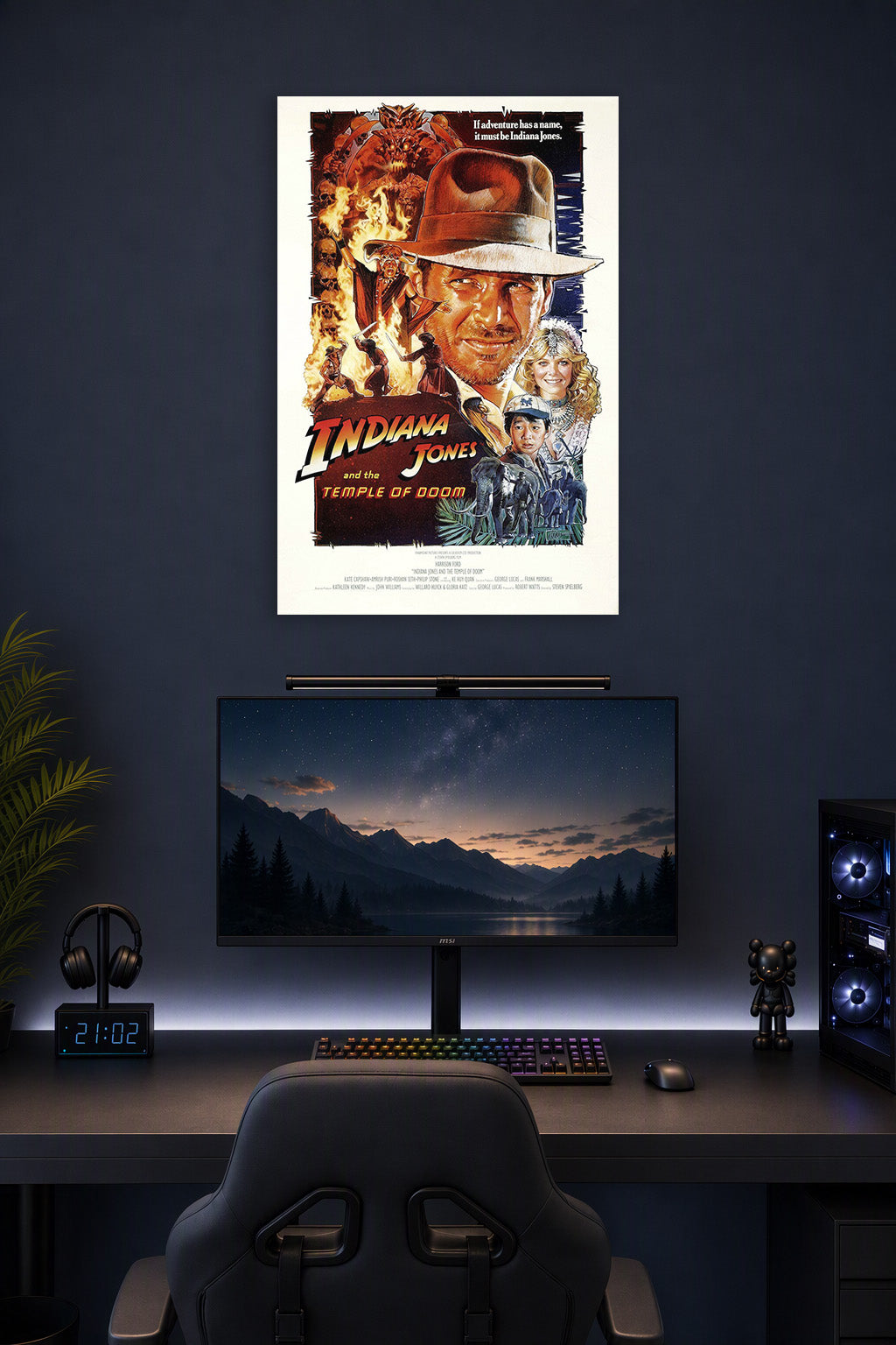 Indiana Jones and the Temple of Doom in a gaming desk setup above a monitor.