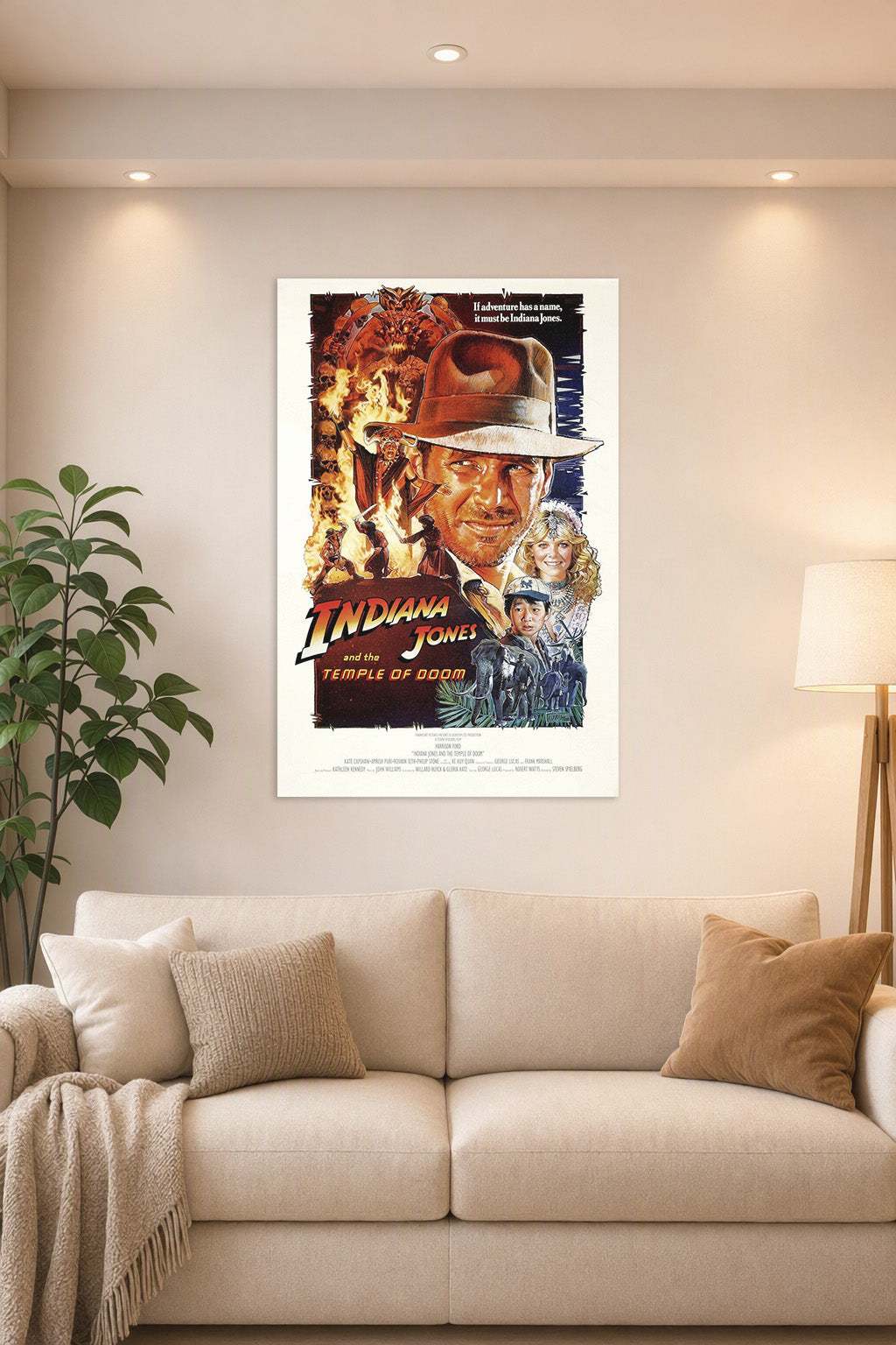Indiana Jones and the Temple of Doom Movie Poster in a bright living room above a beige sofa.
