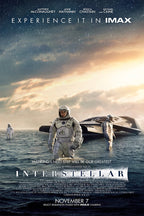 Interstellar movie poster wall art print with three astronauts wading through an ocean beside a spacecraft beneath a starry sunset sky.