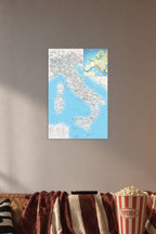 Italy Road Map in a cozy movie room above a brown sofa with popcorn.