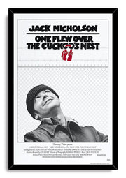 Framed One Flew Over the Cuckoo's Nest wall art print with Jack Nicholson looking up, red handcuffs, and a black frame.