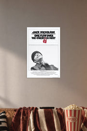 Jack Nicholson McMurphy One Flew Over the Cuckoo's Nest in a cozy movie room above a brown sofa with popcorn.