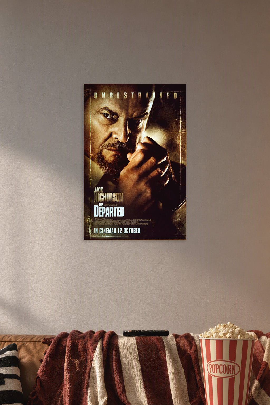 Jack Nicholson The Departed in a cozy movie room above a brown sofa with popcorn.