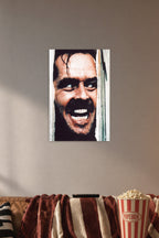 Jack Torrance The Shining in a cozy movie room above a brown sofa with popcorn.