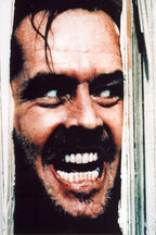 Jack Torrance wall art print from The Shining, with his snarling face pressed through splintered pale wooden door panels.